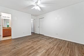 Havelock house for rent - A room with wooden flooring and a ceiling fan.