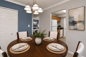 Randallstown apartment for rent - A dining room with a wooden table set for four.
