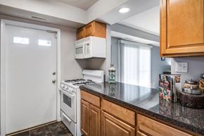 Randallstown apartment for rent - a kitchen with a counter top and a white stove