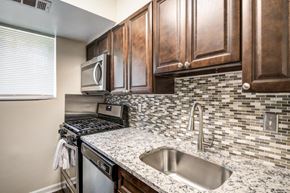 Randallstown apartment for rent - a kitchen with a sink and a microwave