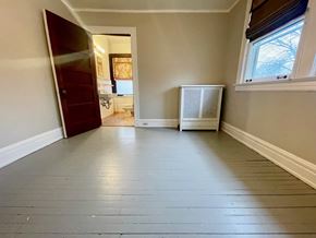 Louisville apartment for rent - A room with a wooden floor and a window.