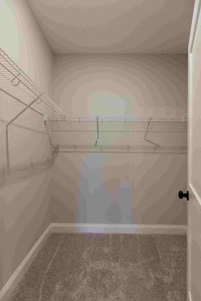 New Richmond house for rent - the spacious walk in closet in the master bedroom of a manufactured home