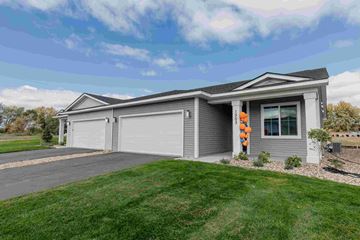 New Richmond house for rent - a gray house with a garage and a driveway