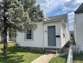 New Albany house for rent - the front of a white house with a blue door