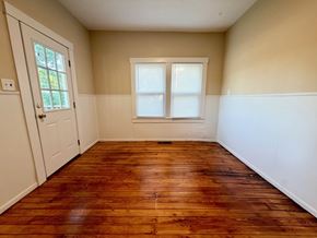 Louisville apartment for rent - A room with a wooden floor and a window.