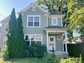 Louisville house for rent - A house with a grey exterior and a white door.