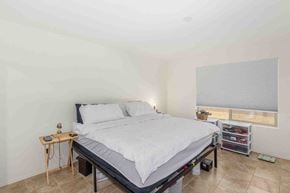 Tucson house for rent - a bedroom with a bed and a window