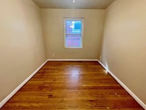 Louisville apartment for rent - A room with wooden flooring and a window.