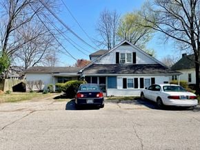 Louisville apartment for rent - a house with two cars parked in front of it