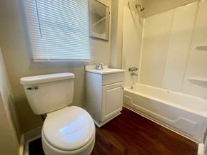 Louisville apartment for rent - a bathroom with a toilet and a tub and a sink