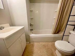 Louisville apartment for rent - a bathroom with a sink toilet and a tub