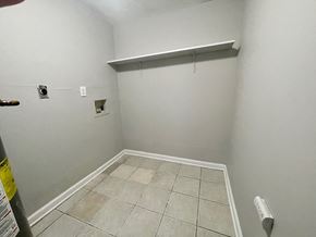 Louisville apartment for rent - a room with a white wall and a tile floor and a closet