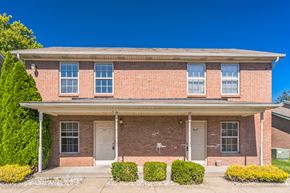 New Albany apartment for rent - the front of a brick house with two doors