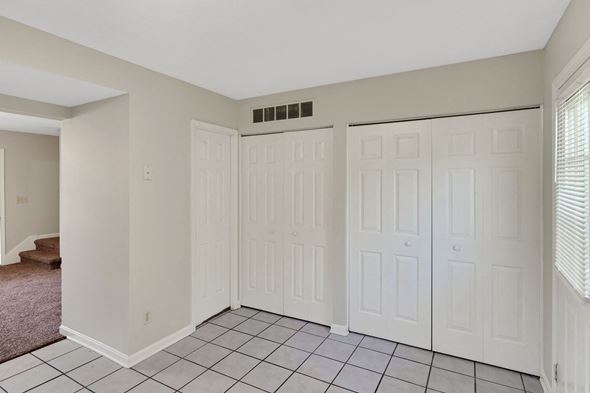 New Albany apartment for rent - the living room has three closets and a tiled floor