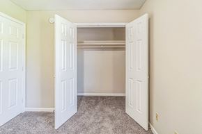 New Albany apartment for rent - an empty bedroom with two doors and a closet