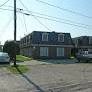 Metairie apartment for rent - a house on a street with a car in front of it