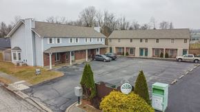 New Albany apartment for rent - an aerial view of a parking lot in front of two houses