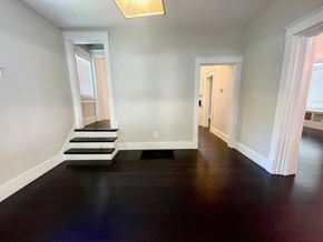 Louisville house for rent - a living room with a hard wood floor and stairs