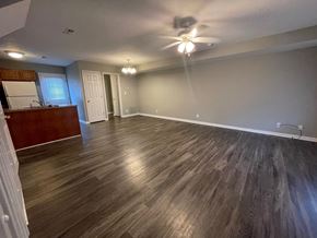 Sellersburg apartment for rent - A room with wooden flooring and a ceiling fan.