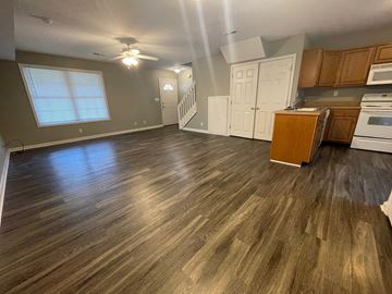 Sellersburg apartment for rent - A kitchen with wooden floors and a stove top oven.