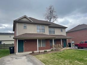Sellersburg apartment for rent - A house with a green door and a red truck parked in front.