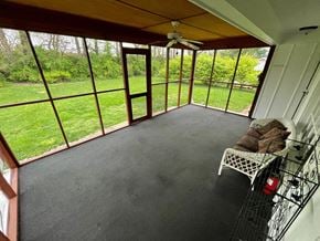 Louisville house for rent - a screened in porch with a view of the grass