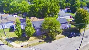 Louisville house for rent - A residential area with houses and trees.