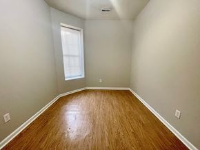 Louisville apartment for rent - an empty room with wood floors and a window