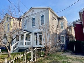 Louisville apartment for rent - a white house with a white fence in front of it