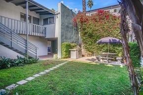 Los Angeles apartment for rent - A small garden with a bench and a table.
