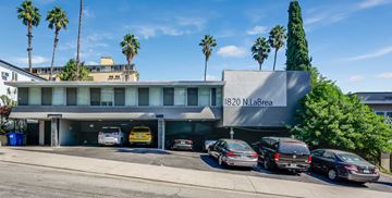 Los Angeles apartment for rent - A building with the address 1820 N. LaBrea is shown with cars parked in front.
