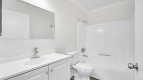 Los Angeles apartment for rent - A white bathroom with a toilet, sink, and bathtub.