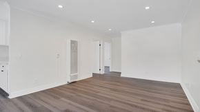 Los Angeles apartment for rent - A room with wooden floors and white walls.