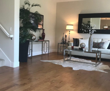 Palo Alto apartment for rent - a living room with a couch and a table and a mirror
