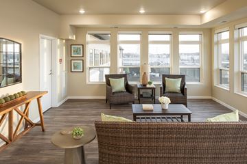Mounds View apartment for rent - a living room with a couch and chairs and a table