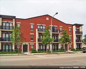 Chicago apartment for rent - a red brick apartment building on the side of a street