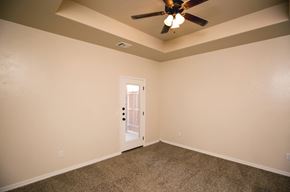 Amarillo apartment for rent - the living room of an empty home with a ceiling fan