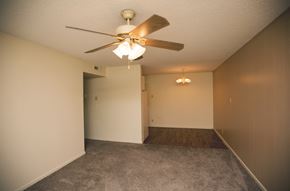 Amarillo apartment for rent - an empty living room with a ceiling fan