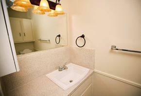 Amarillo apartment for rent - a small bathroom with a sink and a mirror