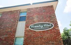 Amarillo apartment for rent - a sign on the side of a brick building