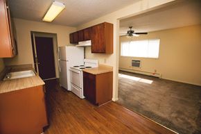 Amarillo apartment for rent - an empty kitchen with a stove and a refrigerator