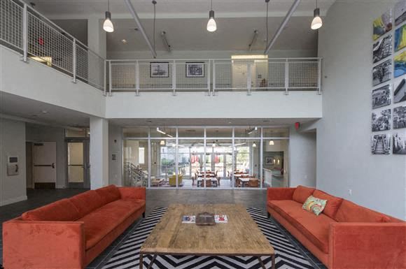 Philadelphia apartment for rent - a living room with orange couches and a coffee table