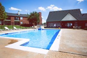 Amarillo apartment for rent - a swimming pool with a house in the background