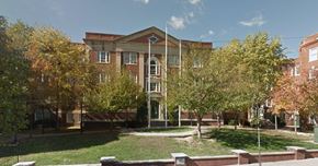 Philadelphia apartment for rent - a large brick building with trees in front of it
