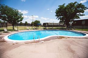 Amarillo apartment for rent - a swimming pool with a fence around it