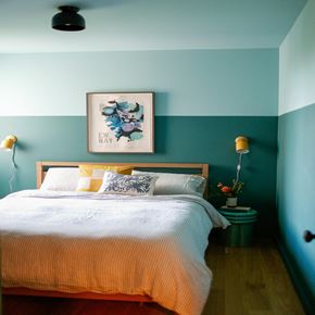 Seattle apartment for rent - a bedroom with a bed and a painting on the wall