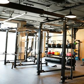 Seattle apartment for rent - a gym with weights and a rack of balls in it