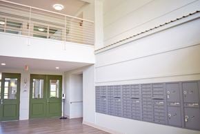 Chester apartment for rent - a view of the hallway of a building with lockers and a door