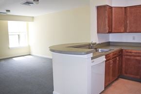 Chester apartment for rent - an empty kitchen with an island in the middle of it
