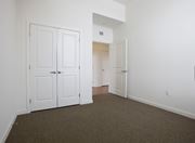 York apartment for rent - an empty bedroom with white doors and carpeting